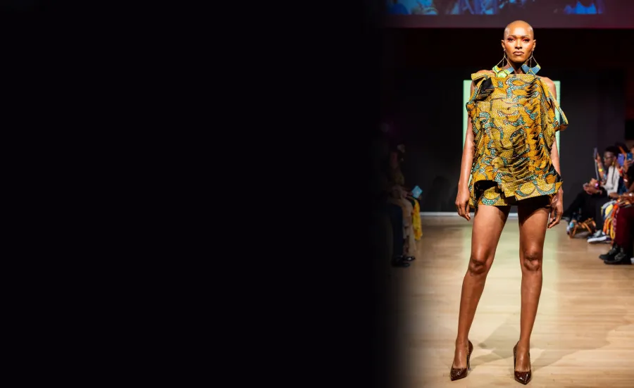 Model on a catwalk showcase designs from MA fashion students