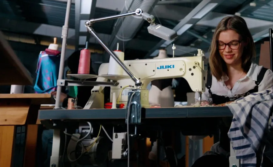 BA Fashion Design student working with sewing machine