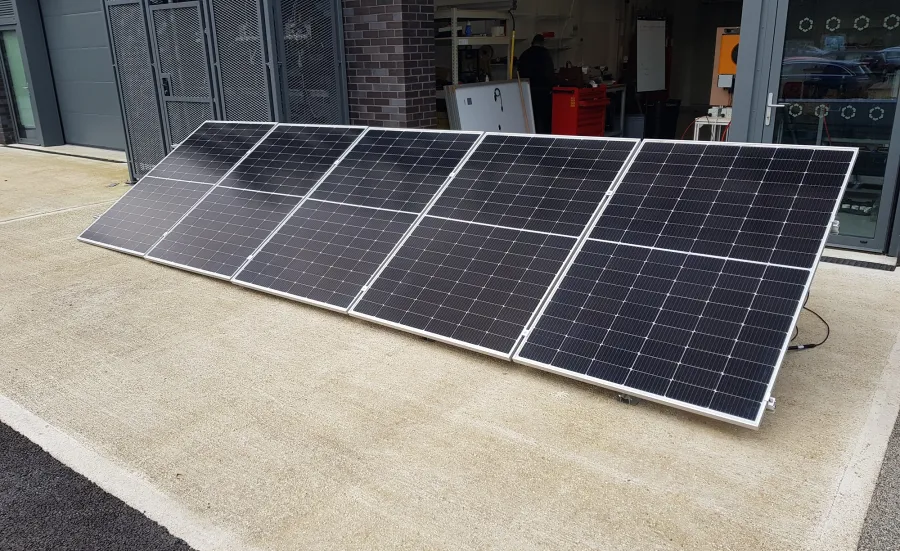 Solar panels on the floor at the entrance of a workshop