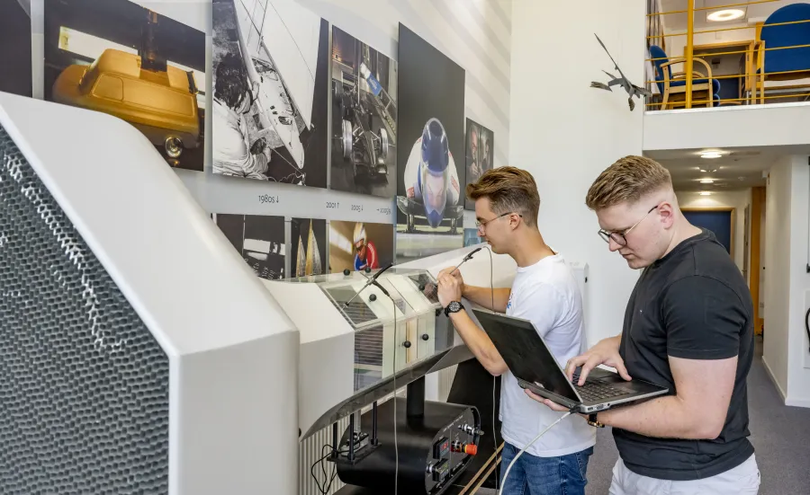 MEng Aeronautics and Astronautics Spacecraft Engineering students working at machinery