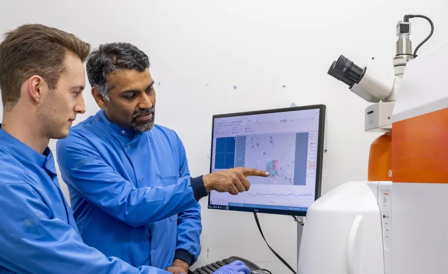 Professor Sumeet Mahajan and student at a computer