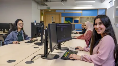 A group of students working in the Financial laboratory