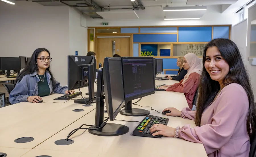 A group of students working in the Financial laboratory