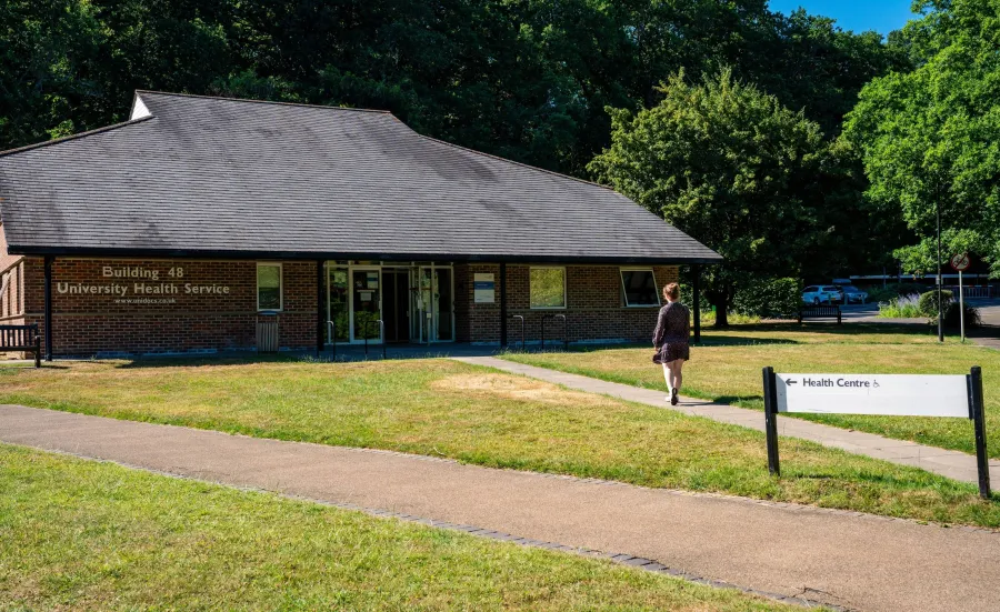 The University of Southampton's health service centre, also known as Building 48. There is a student walking down the path towards the entrance.