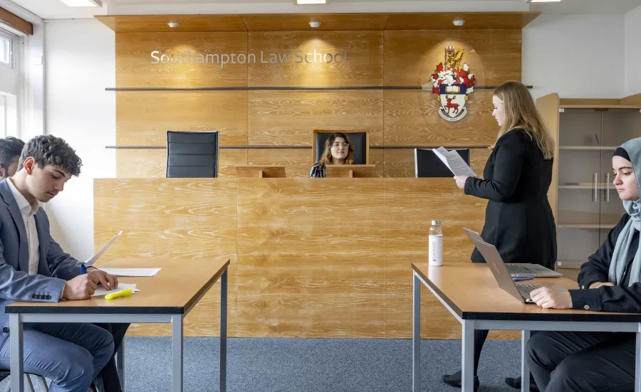 Law students practising in the Moot court room.