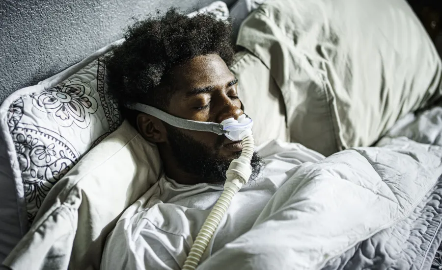 Patient using respitory equipment