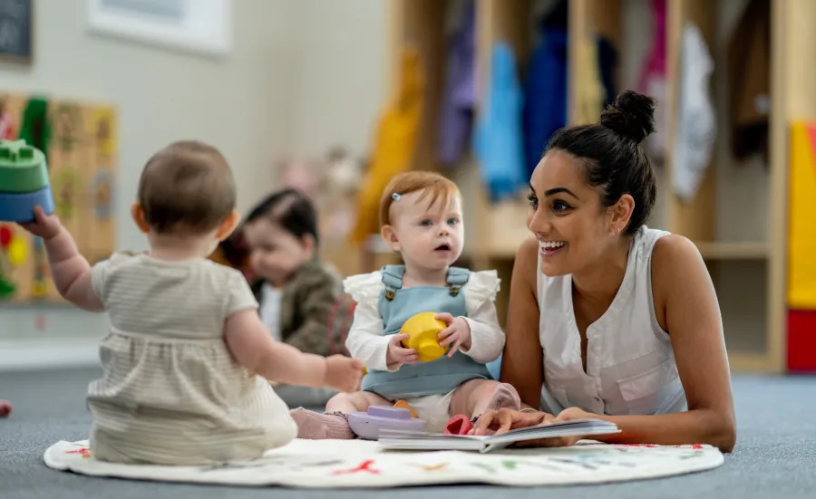 Early Years Centre worker with children