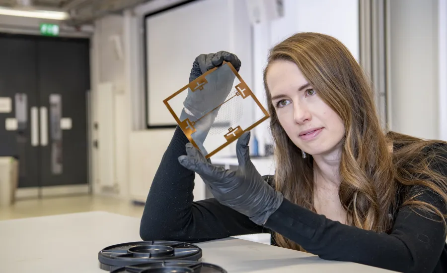 Computer engineering student looking at computer parts