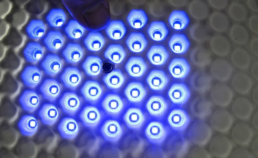 A group of blue hexagonal lights on a wearable technology material