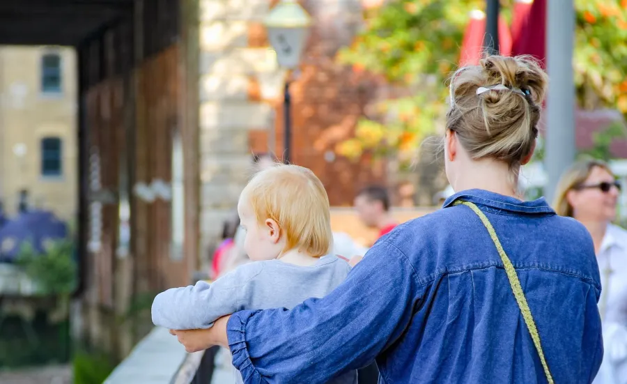 Mother walking with child