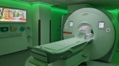 An MRI scanner bathed in green light