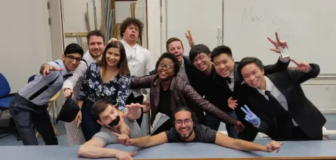 Group of happy students backstage after a show. 
