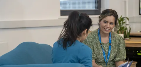 Adviser and student in conversation. 