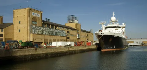 Waterfront Campus and the surrounding docks and boats on a sunny day.