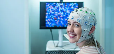 A student wearing an EEG cap.