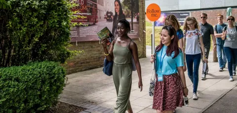 A student shows a group of visitors around Highfield campus