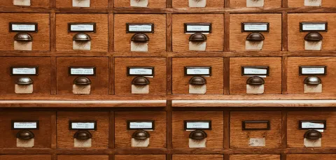 A block of wooden card catalogue drawers