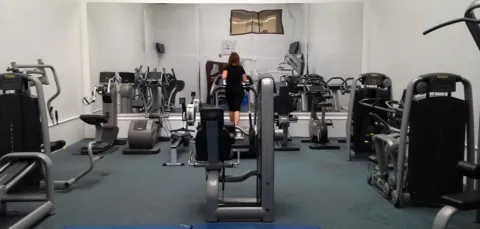 Girl on treadmill in gym
