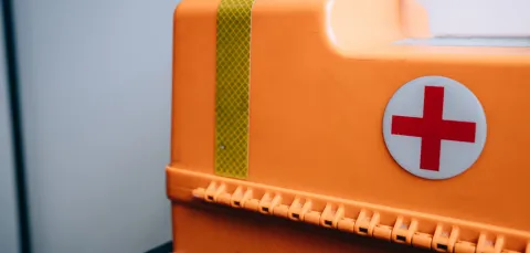 Orange first aid plastic box