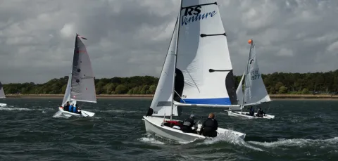 3 dinghies sailing along the coast