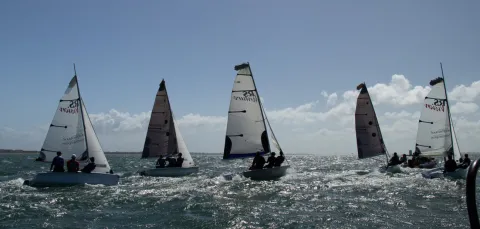 5 dinghies sailing on choppy sea