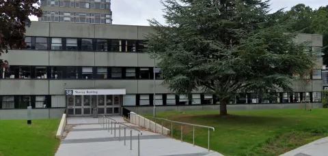 Outside shot of the Murray Building, a long, low 70s-style concrete builing