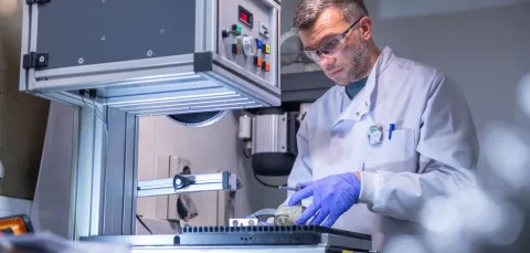 Scientist using laboratory equipment in NNUF-EXACT facility