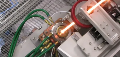 Preform in furnace on tower