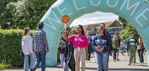 Guide taking students on a tour of the campus