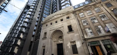 Exterior of the Lloyd's  building showing both the modern and historic buildings