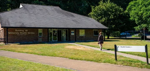 The University of Southampton's health service centre, also known as Building 48. There is a student walking down the path towards the entrance.
