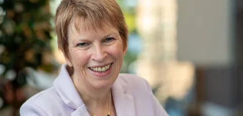 Sue smiling for the photo. 