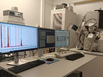 The Focused Ion Beam (FIB) Facility. The image shows three computer screens showing data, with laboratory equipment in the background