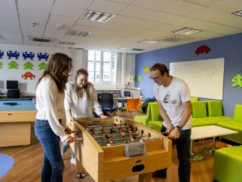 Students playing table football in the medics' common room.