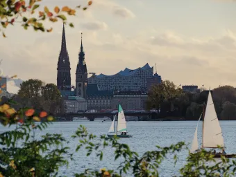 A cloudy sunset in Hamburg, looking across the river to the cathedral.