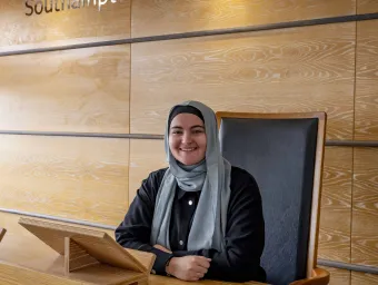 Nora Belkhiter, Law student, sits at the moot court bench in Southampton Law School..