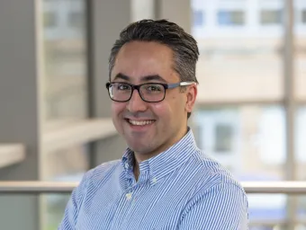 A crisp headshot of Ali Roghanian