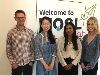 4 students standing in front of a MOSL sign.