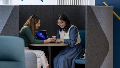 Two students studying with laptop