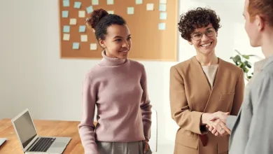 image of people in the workplace shaking hands