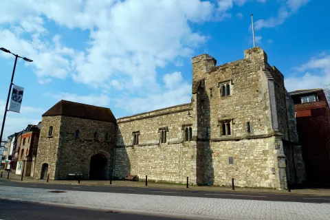 Outside view of the grey stone walls of God's Tower.