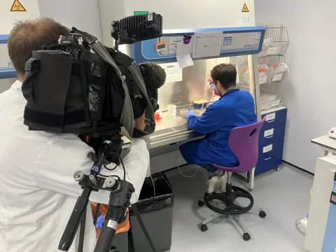 Filming a technician working in a fume cupboard
