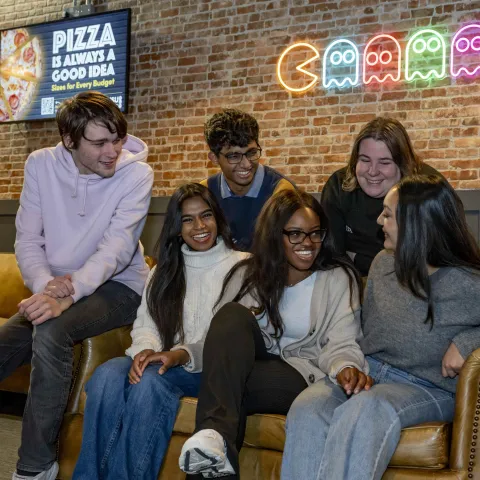 A group of students sitting on a sofa in the students union