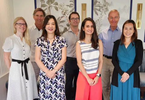 The NiPPeR study team, stood in a light and bright room. There are two rows with three men in the back and four women in the front.