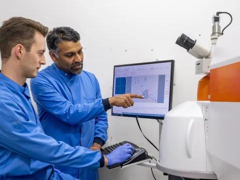 Professor Sumeet Mahajan and student at a computer