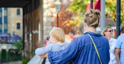 Mother walking with child