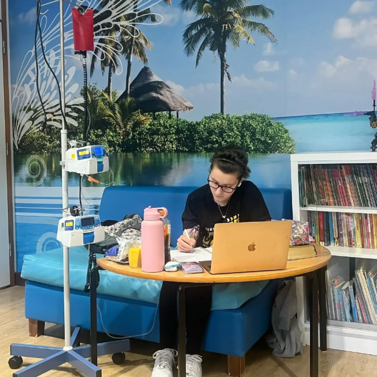 Gio keeping up with her studies while she receives treatment in the hospital.