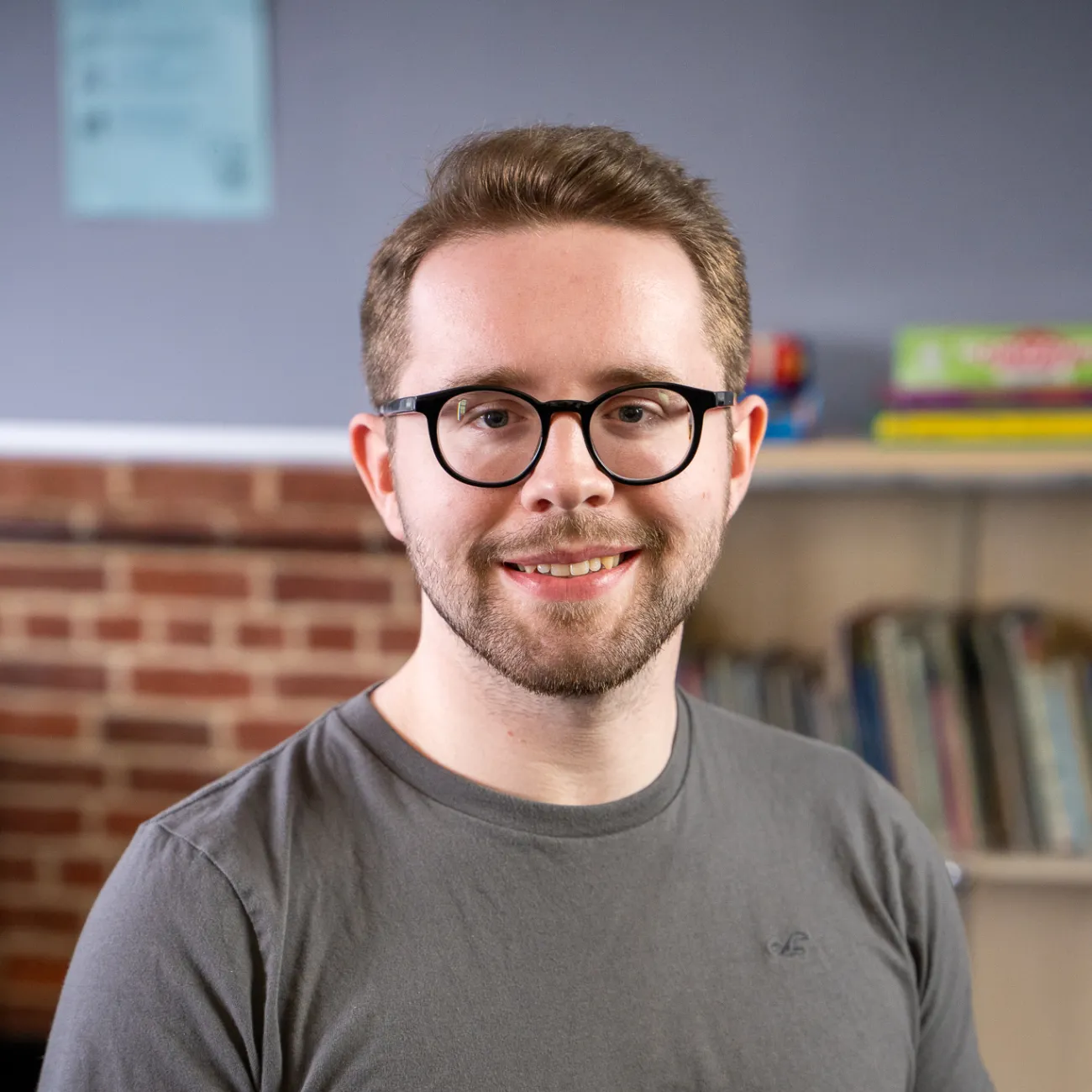 Nick sat smiling for a picture.