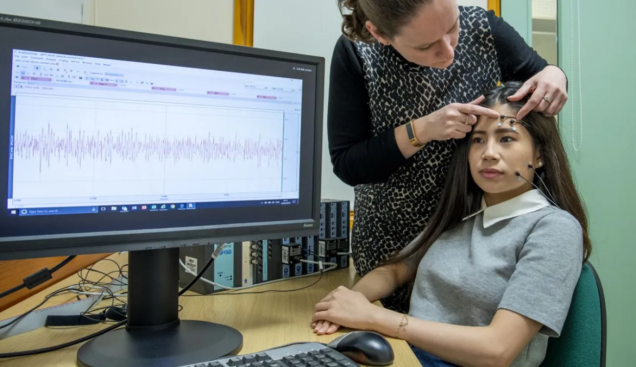 A study participant is prepared for a facial electromyography experiment