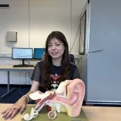 Isabel McGauley with a model of the inner ear